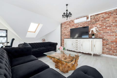 Enjoy your favorite shows on the flat-screen television in the elegant living area.