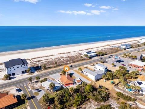 Spectacular beachfront location with pristine sandy shores and crystal blue waters just steps from the coastal community.