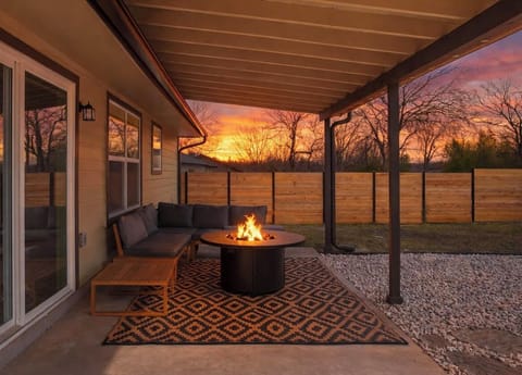 Enjoy the patio with a spacious sectional couch, table, and propane fire pit/ table.