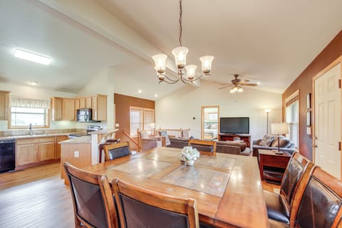 Gather around your spacious dining table while the open kitchen invites culinary adventures and the living room beckons for cozy evenings together.