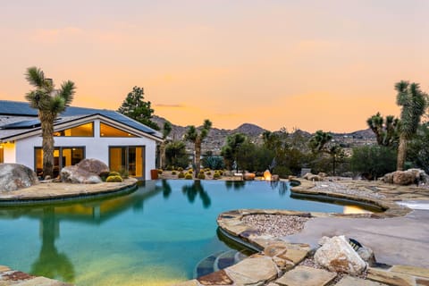 Large natural pool with heating available seasonally for a fee.