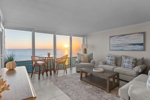 Bright, open living space with uninterrupted sunrise ocean views.