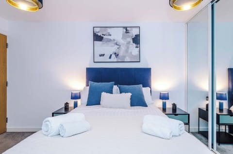 Bedroom Retreat: Stylish decor and soft lighting create a serene escape for restful nights!