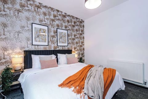 Elegant Bedroom: Unwind in this stylish retreat with chic decor and warm, inviting tones!