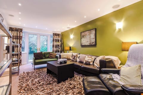 Living Room: Chic retreat with plush seating, vibrant decor, and serene garden views!