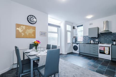 Dining Area: Bright and cheerful space for memorable meals with loved ones!