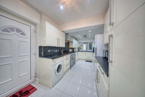 Spacious Kitchen: Bright, modern kitchen with sleek surfaces, perfect for culinary adventures!