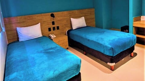 Drift off comfortably in twin beds with a calm, modern vibe.