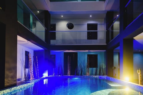 Relax after dark with glowing pool lights and serene surroundings.