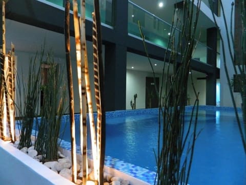 Savor tranquil evenings as soft lighting shimmers across the pool.