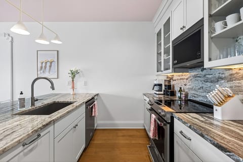 Bright kitchen with island seating and modern appliances.