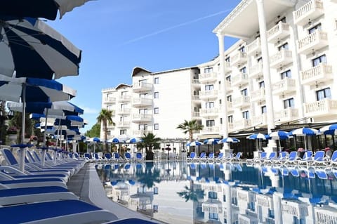 Outdoor pool, open 9:00 AM to 10:00 PM, pool umbrellas