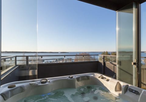 Unwind in style. Soak in the warm bubbles of your private rooftop hot tub while taking in breathtaking, unobstructed views of the lake