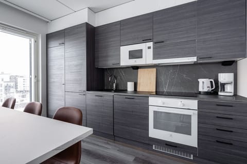 Cook up a feast in our sleek, fully equipped kitchen. Featuring modern appliances and ample counter space, it has everything you need from your morning coffee to a gourmet dinner.