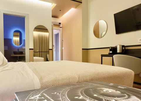 Deluxe Quadruple Room, Private Bathroom, City View | Free minibar, in-room safe, individually decorated
