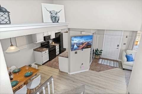 Your open-concept space flows beautifully from kitchen to living area, perfect for relaxing after exploring local adventures.