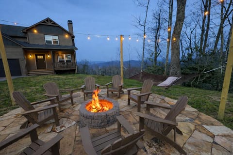 Large fire pit area with lights and hammocks to gather with friends and family.