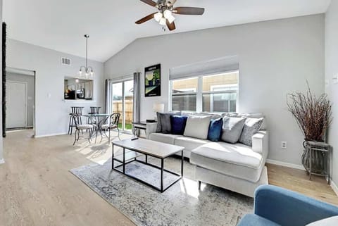 Lots of light, sofa, reading chair, and dining table