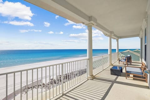 Step onto your private balcony and breathe in the salt air while watching waves lap pristine white sand beneath endless blue skies.