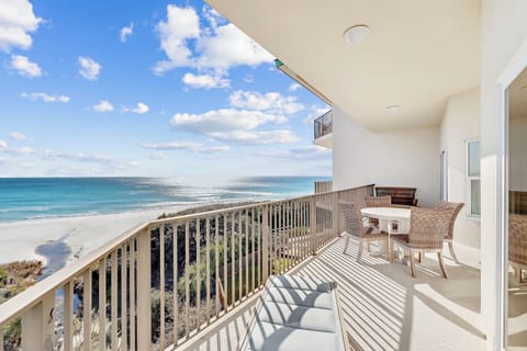 Your private balcony offers breathtaking ocean views where you can sip morning coffee while watching waves kiss pristine white sand.
