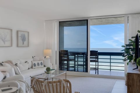 Bright living room with stunning ocean views and cozy seating
