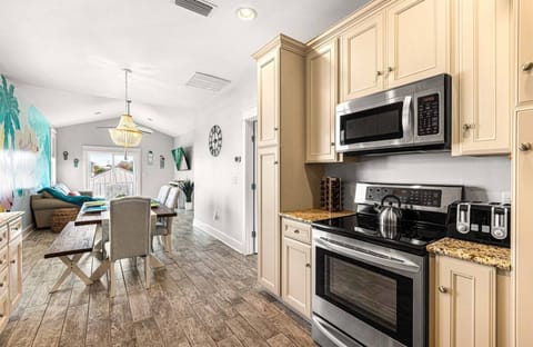 Cooking here never feels like a chore. The open kitchen and dining space keeps everyone connected, whether someone is cooking, setting the table, or just hanging out nearby.
