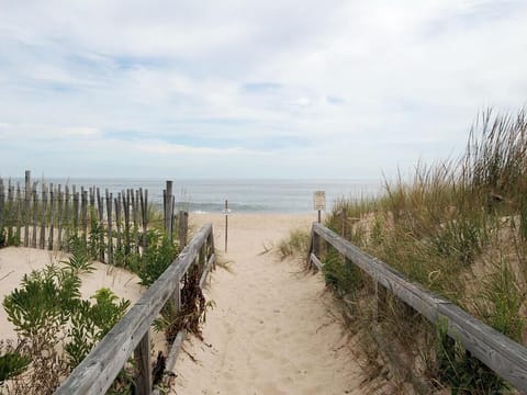 Sandy private beach walkway just steps away, leading directly to the ocean.