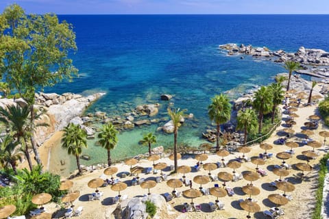 Private beach, white sand, sun loungers, beach umbrellas