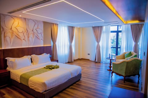 Deluxe Double Room, Balcony, Mountain View | In-room safe, desk, laptop workspace, blackout drapes