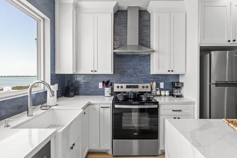 Cook, dine, and enjoy in this modern, well-appointed kitchen.