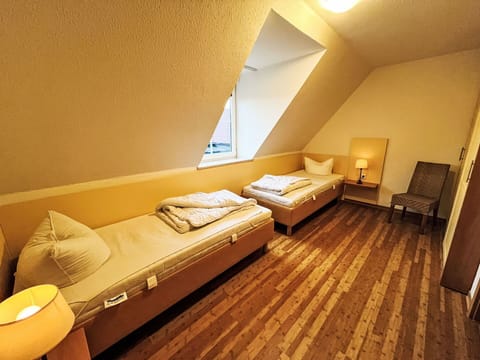 Wood, Interior Design, Floor, Bedroom, Flooring, Bed, Furniture, Room, Bed Sheet, Bedding