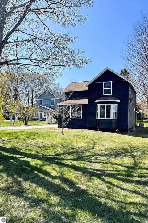 EXETERIOR:  The front of the house in Spring