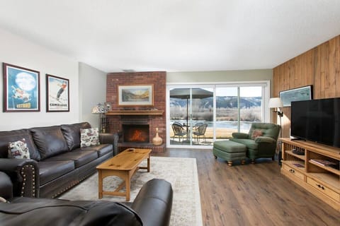Open floor living room with pond views