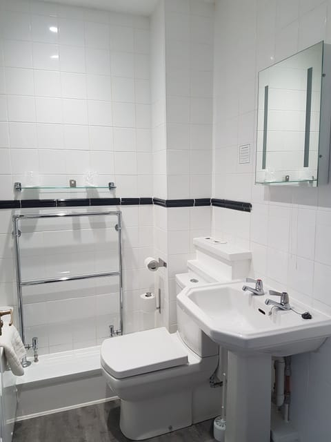 Combined shower/tub, hair dryer, towels, soap