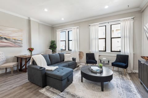 Open concept apartment with panoramic views of the downtown square.