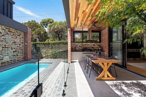 Enjoy quiet moments on the shaded patio, the perfect spot for morning coffee or a peaceful break in the fresh air.