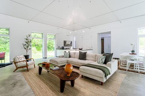 Bright and airy great room with views of the forest