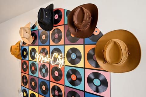 Cowboy hats, vintage records, and a Music City neon sign set the tone for your group's weekend. This game room pulses with Nashville energy from dusk until well past dark