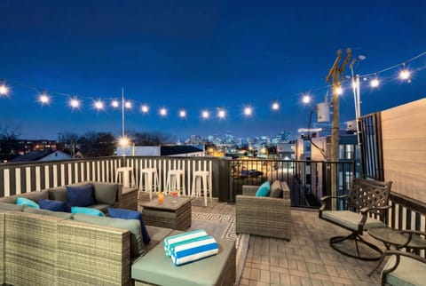 Gather on the rooftop under string lights for Nashville skyline views and late-night conversation. Book your stay with Misfit Homes to make group memories that stick