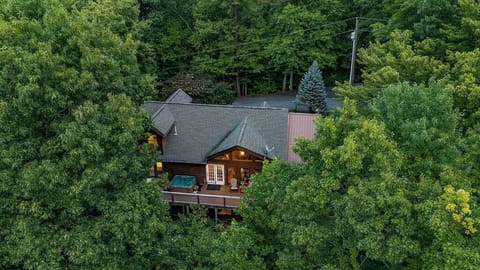 Secluded woodland cabin with a hot tub deck and cozy lodge charm