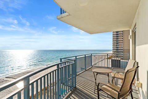 A balcony like this becomes the heart of a beach vacation—an easy, breezy extension of the living space with views that pull you outside again and again.