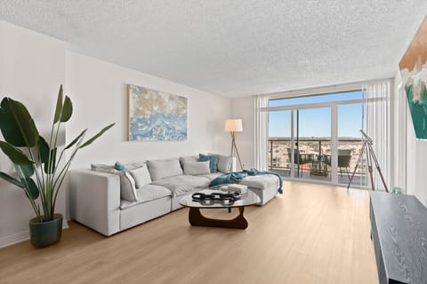 Sun-drenched living area with designer finishes and a private sunset balcony.