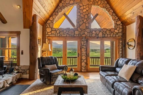 Main Cabin: Living area with fireplace and views