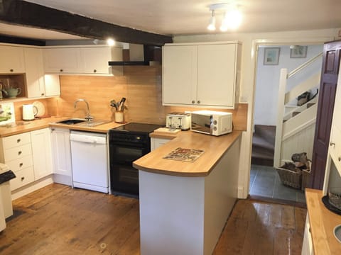 Kitchen showing stairs | Brook House 1 - Brook House Cottage Holidays, Bassenthwaite