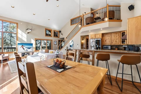 Gather your loved ones in this stunning open-concept space where rustic charm meets modern comfort for memorable mountain retreat moments.