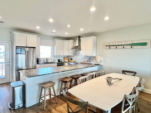 Enjoy meals at the spacious dining table or at the kitchen island!