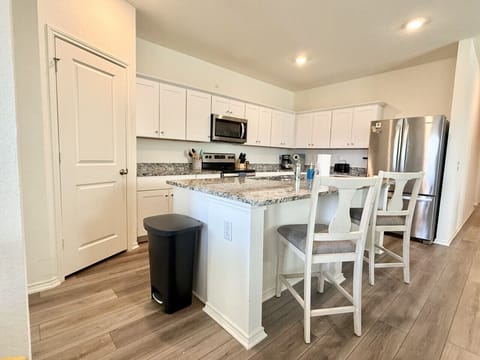 Create unforgettable meals in this beautifully designed, fully equipped kitchen. Gather your group to savor delightful dining experiences in the elegant dining area.