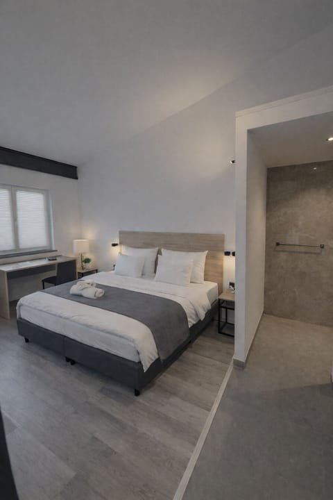 Deluxe Double Room, Kitchenette | Desk, laptop workspace, blackout drapes, soundproofing