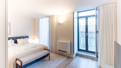 Elegant bedroom with Juliet balcony and natural light. 
#BalconyBedroom #DesignRetreat #PortoLiving #BoutiqueRental