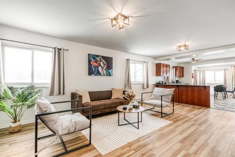 Indulge in a sophisticated atmosphere where artistic flair meets seamless functionality. This expansive living area serves as an elegant backdrop for both quiet reflection and lively conversation. Elevate your travel experience.